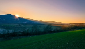 An inspiring landscape with a sunrise, representing new beginnings.
