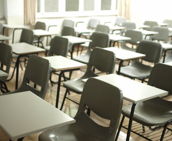 white table with black chairs in a school cleaned professionally by commercial cleaners
