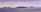 Several cruise ships are sailing on a calm sea beneath an overcast sky. The horizon is visible, with ships positioned from left to right, indicating a procession or fleet at sea.