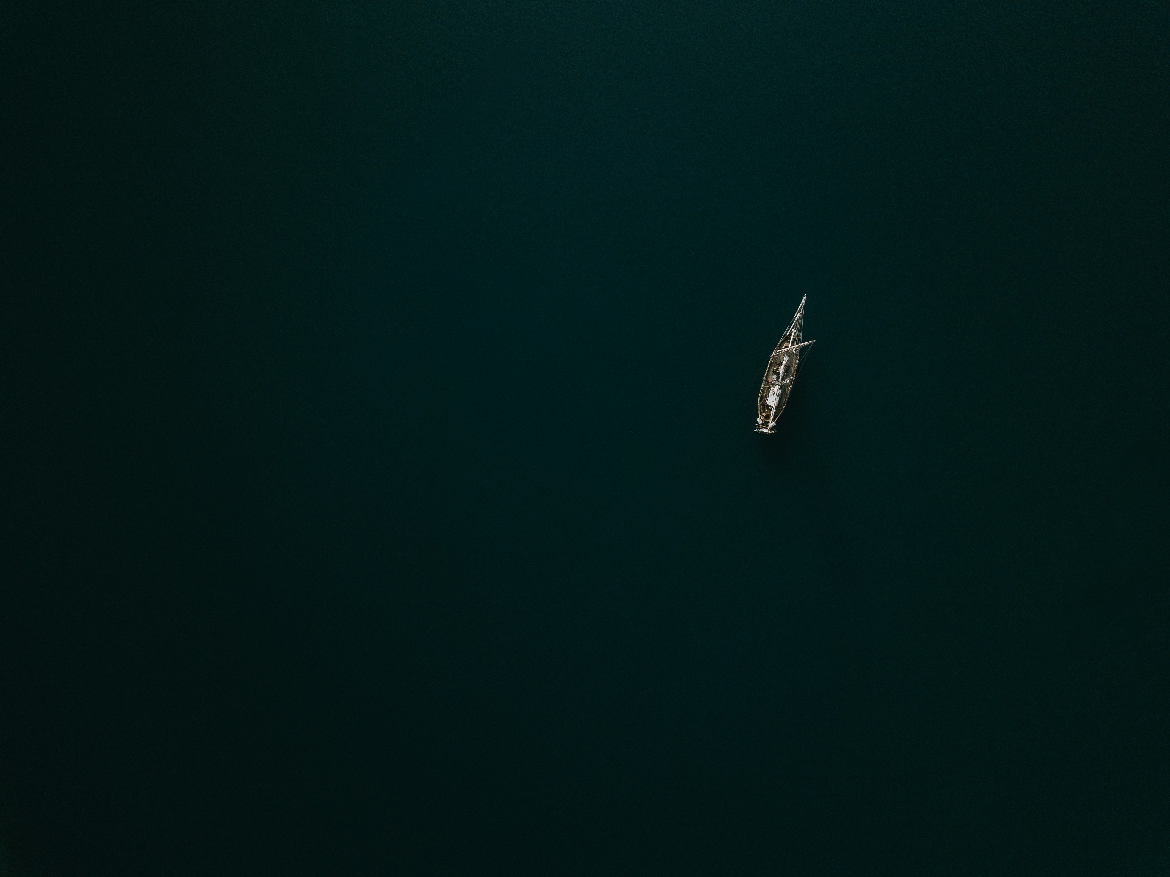 white boat on blue water