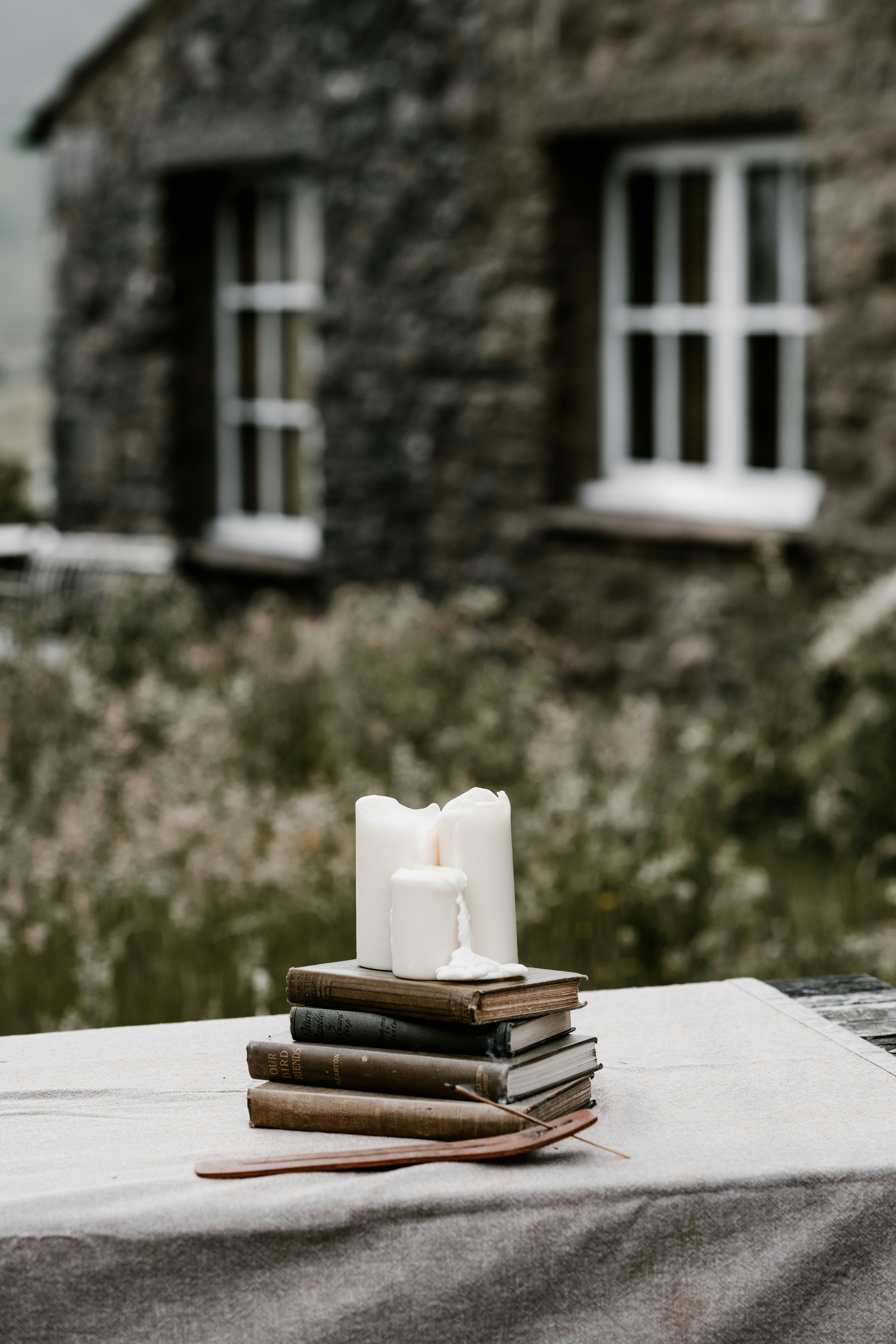 white ceramic candle holder on book page