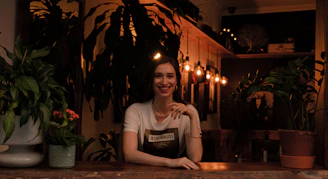 woman in gray crew neck t-shirt sitting on chair