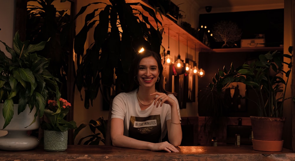 woman in gray crew neck t-shirt sitting on chair