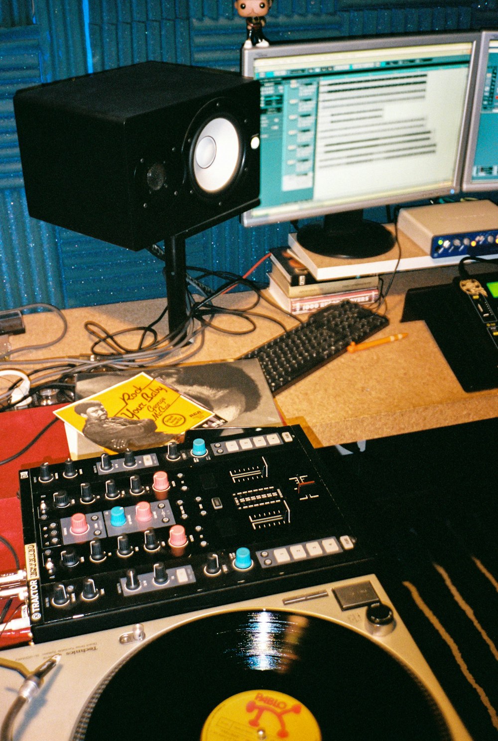 black audio mixer beside black computer keyboard