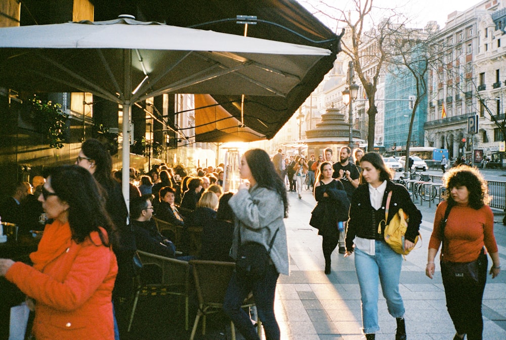 people walking on sidewalk during daytime