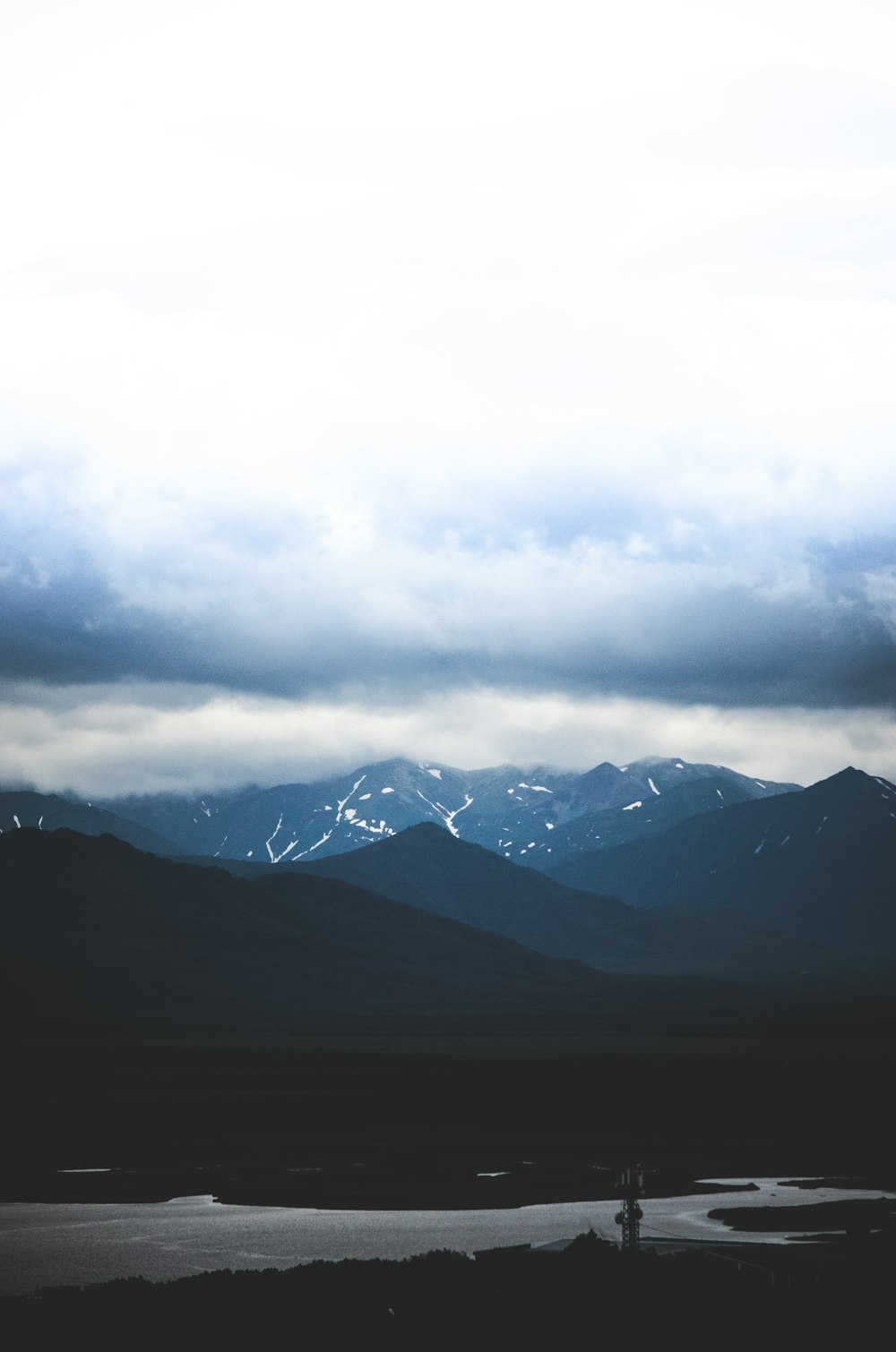 black mountains under white clouds during daytime