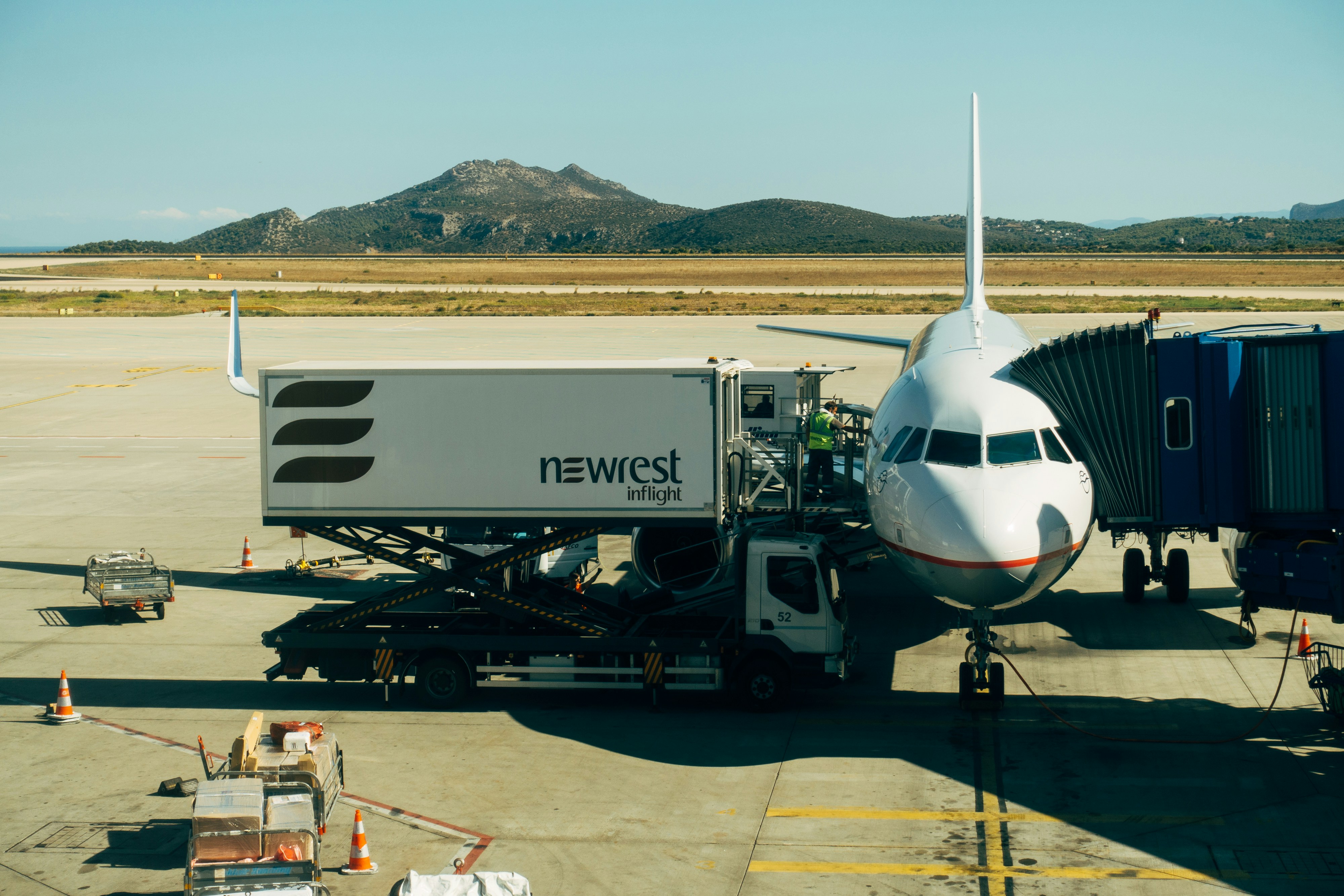 white and blue airplane on airport during daytime, 