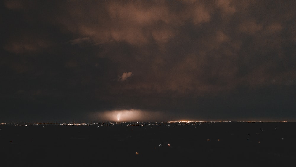 silhouette of city lights during night time