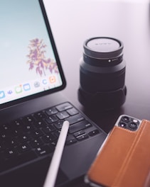 Close-up of hands showing skill tools like a guitar, camera, and laptop.