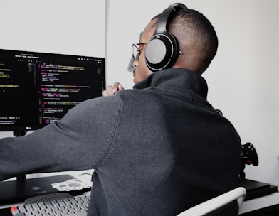 Man at office desk wearing headset