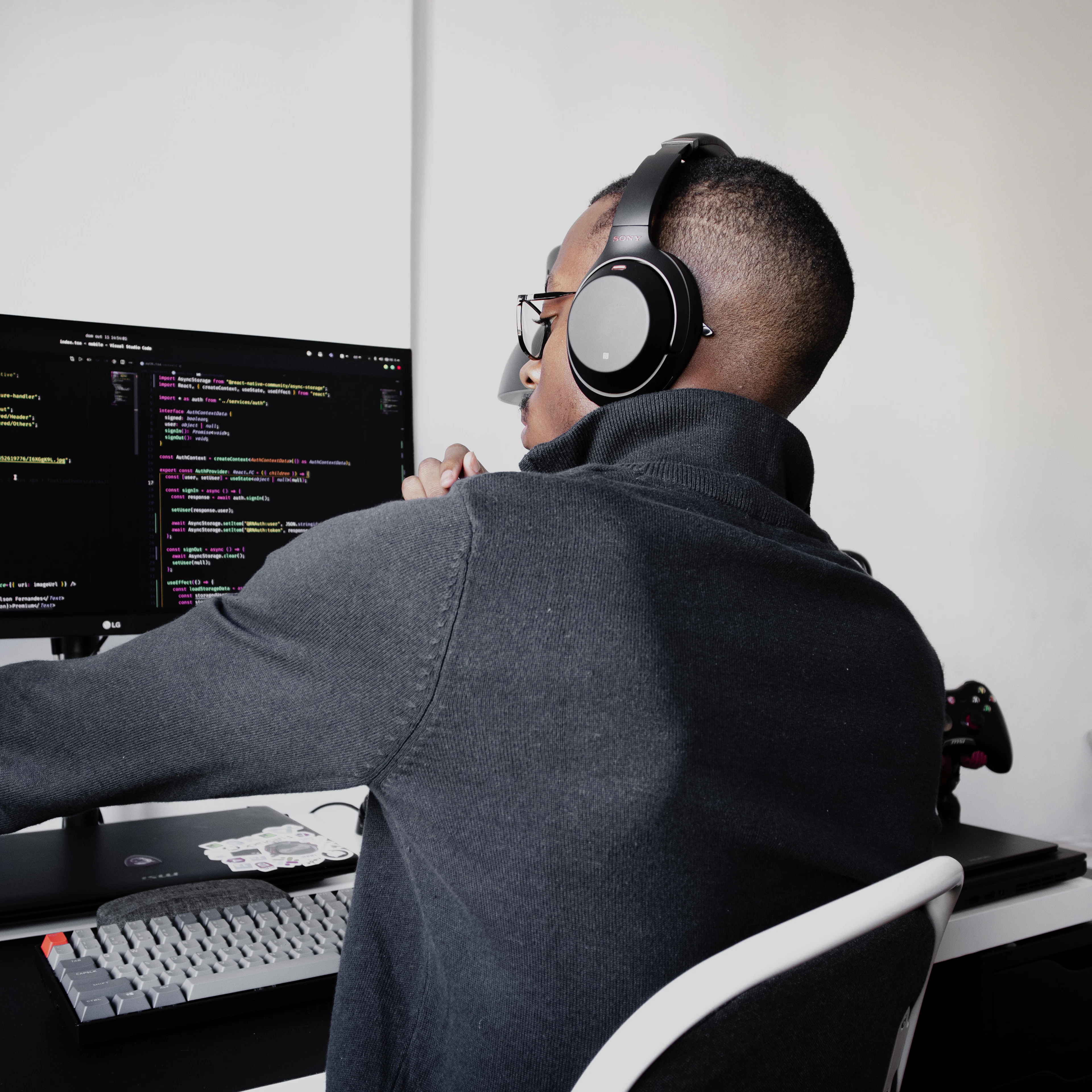 Software engineer working across multiple monitors