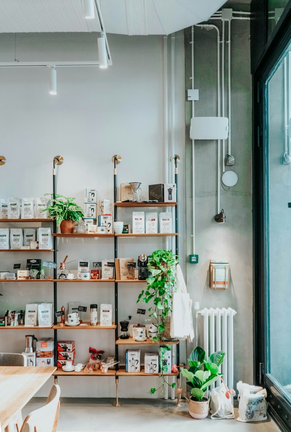 brown wooden shelf with green plants