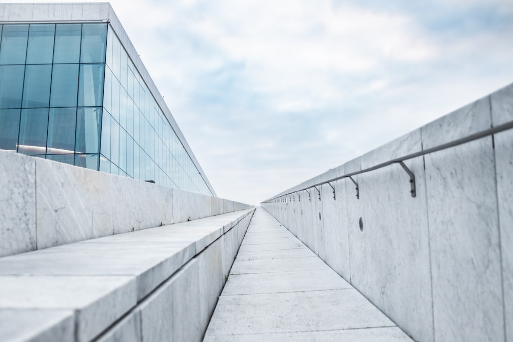 gray concrete building under white clouds during daytime