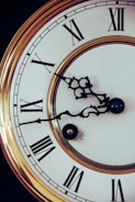 brown and white analog clock