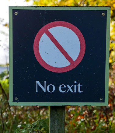 A clear signpost with multiple arrows pointing to 'No Entry' zones, symbolizing service exclusions.