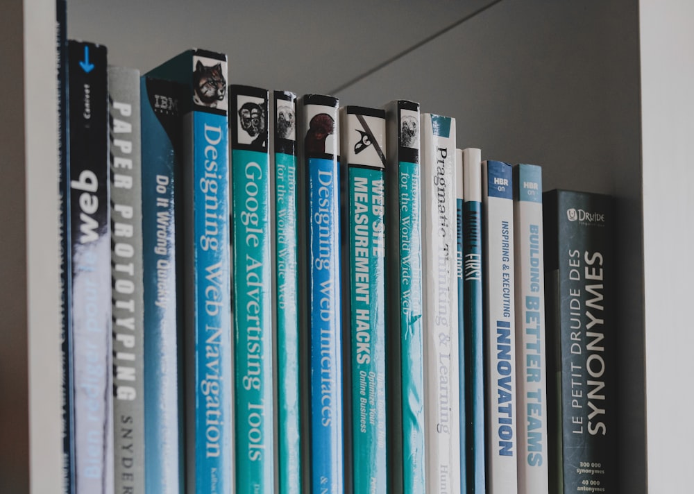 books on black wooden shelf