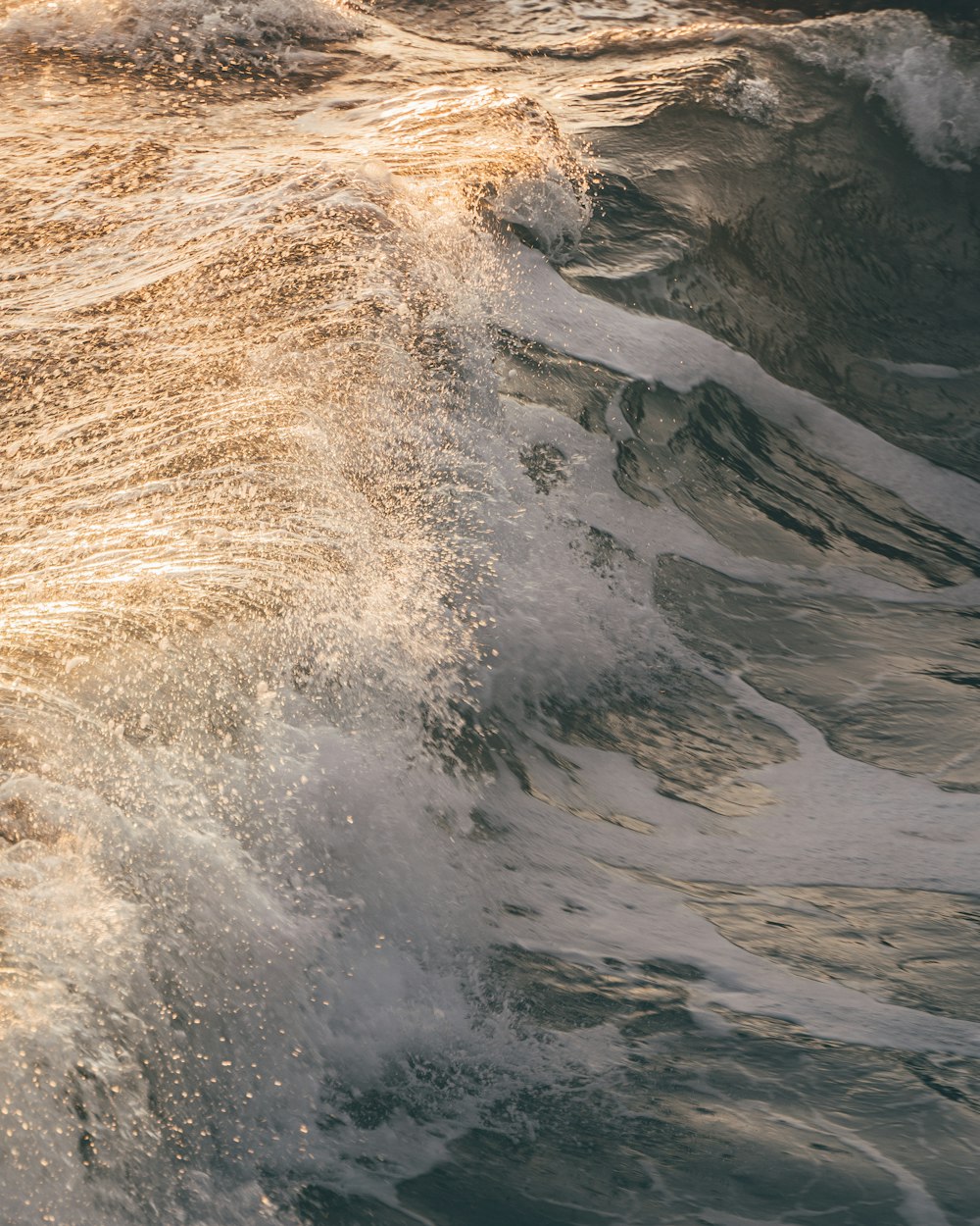 ocean waves crashing on shore during daytime