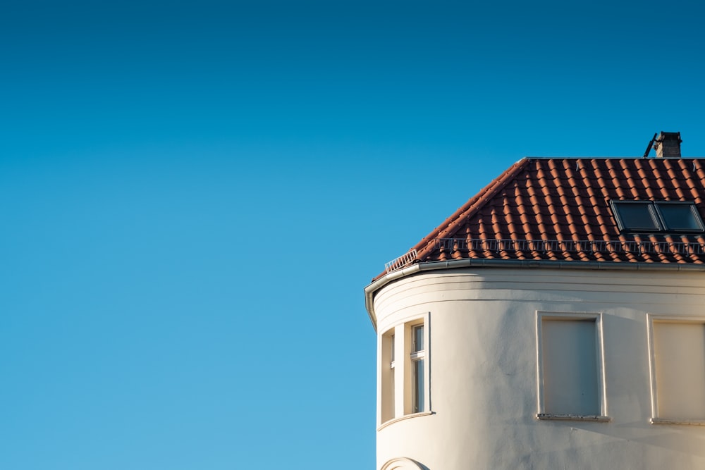 white and blue concrete building under blue sky during daytime