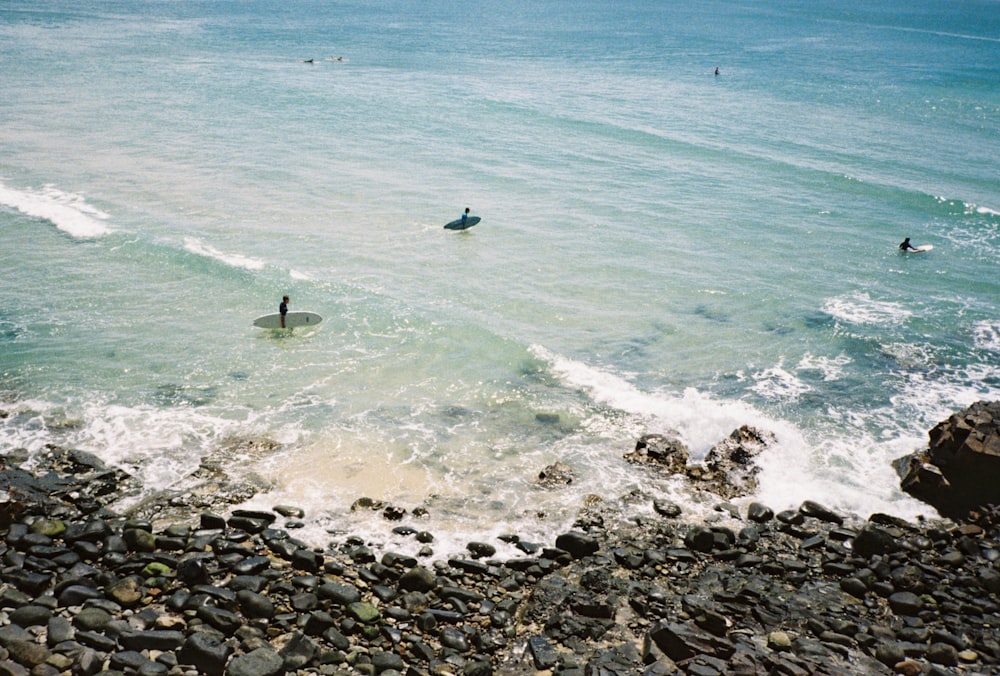 person surfing on sea waves during daytime