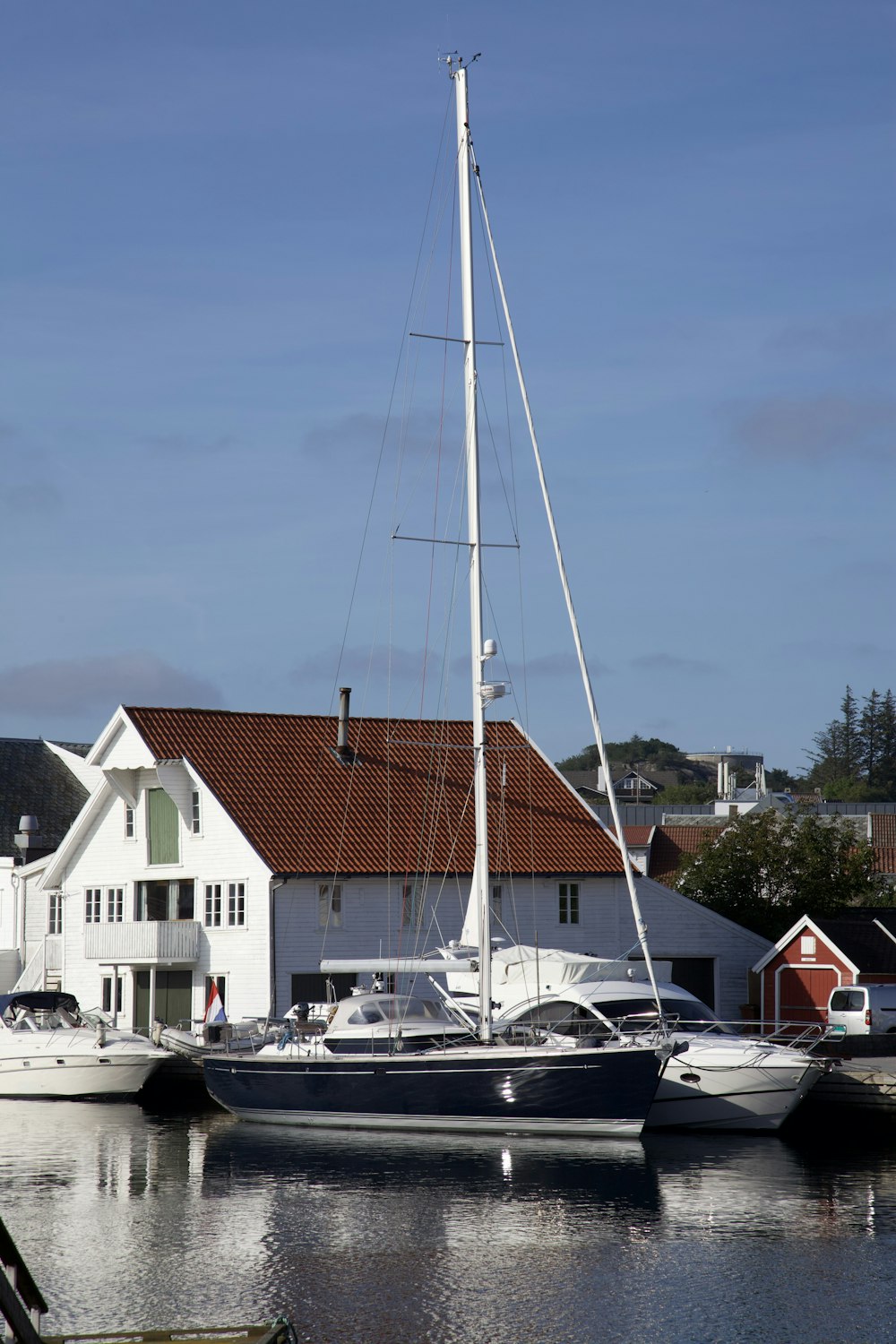 white and brown boat on dock during daytime