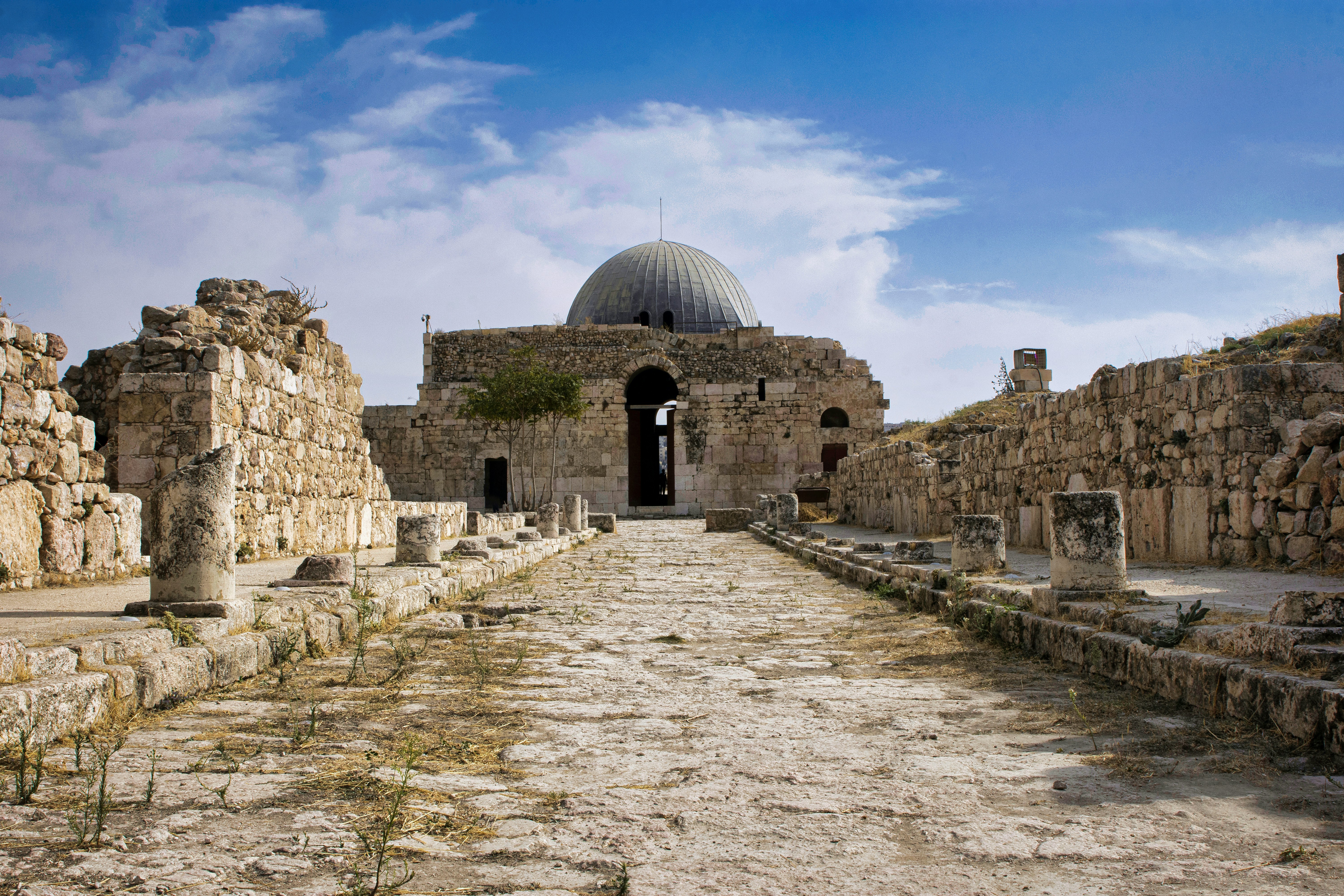 Towering above the capital city of Amman on a hill is the Amman Citadel. This historic site comprises a 1700 meter wall that dates back to the Bronze Age, the iconic Temple of Hercules, and the Umayyad Palace. With so many significant landmarks located one site, the Amman Citadel is arguably one of the best places to visit in Amman.