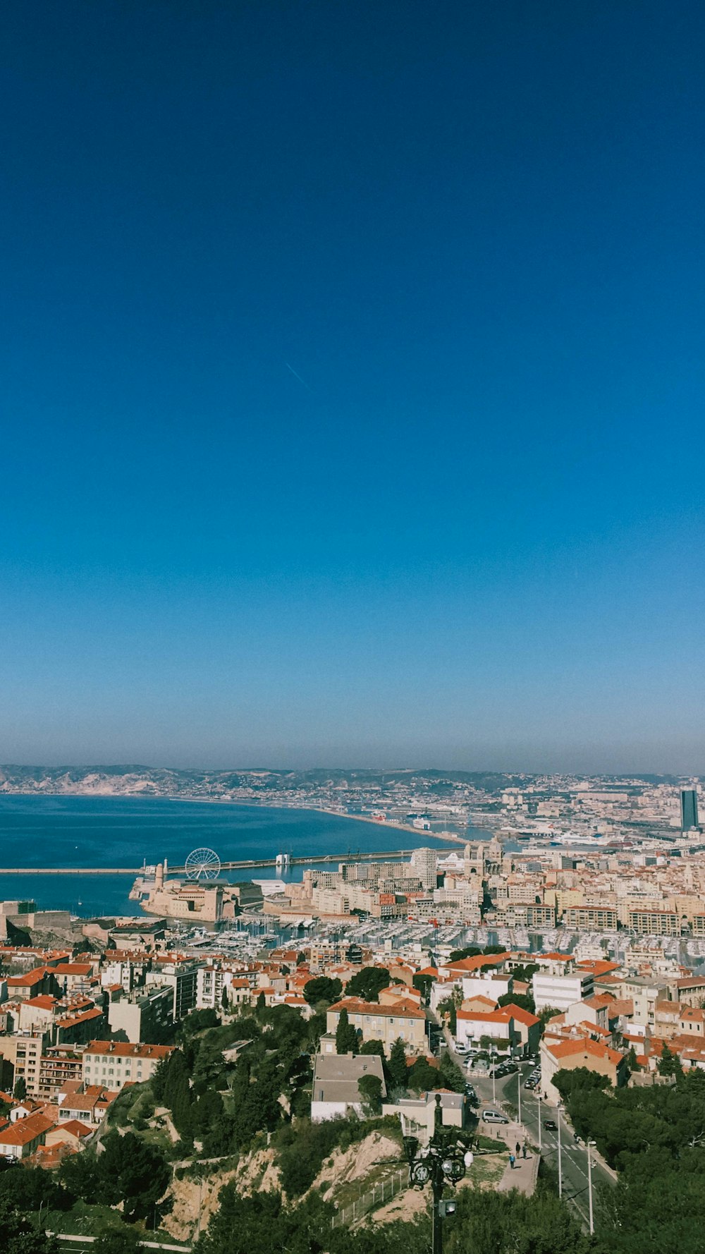 city buildings near body of water during daytime