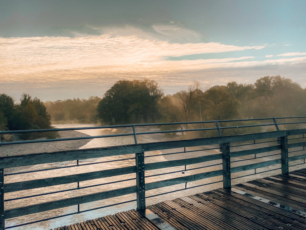 brown wooden bridge over the river