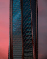 A sleek office building in Dubai's skyline at sunset, reflecting modern professionalism.