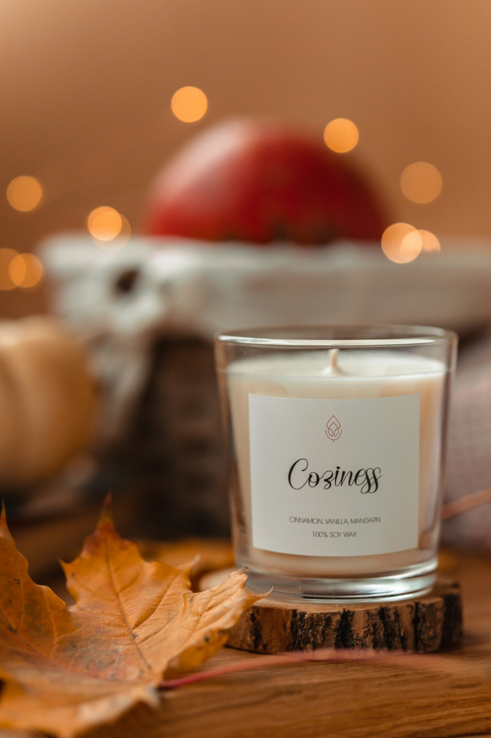 clear glass candle holder on brown wooden table