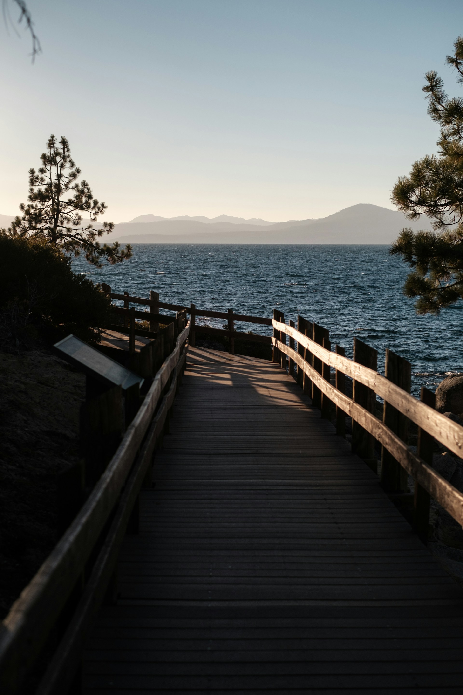 brown wooden dock on lake during daytime