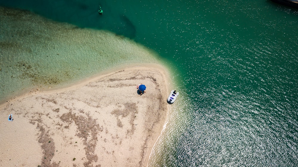 aerial view of white boat on sea during daytime