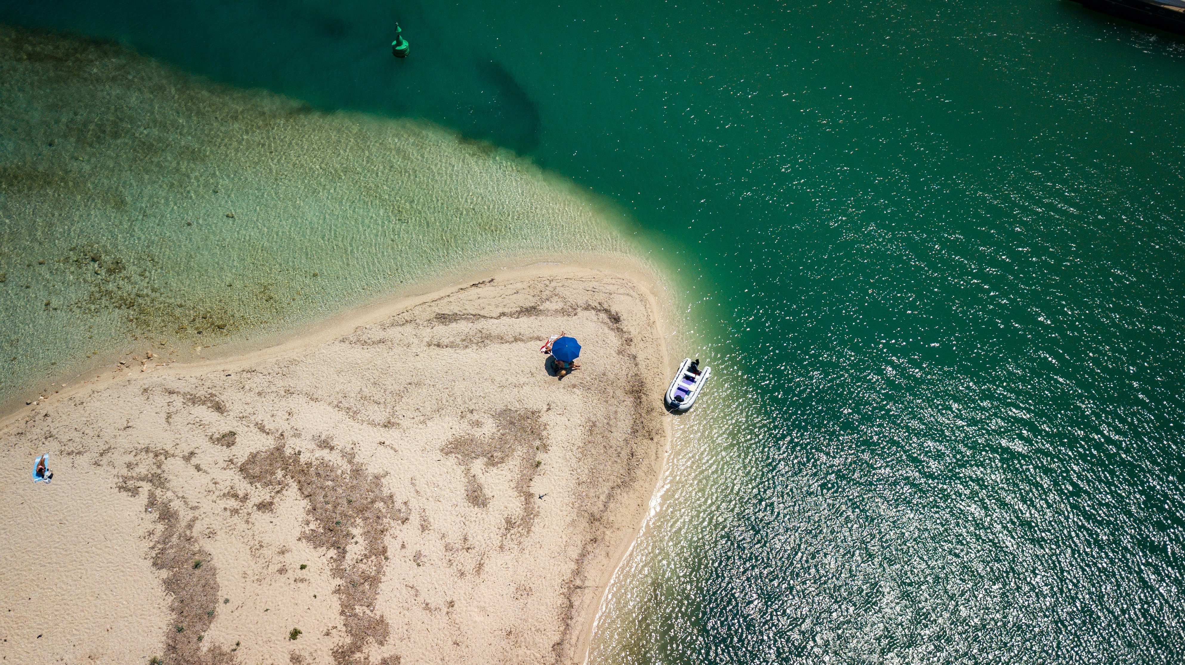 aerial view of white boat on sea during daytime