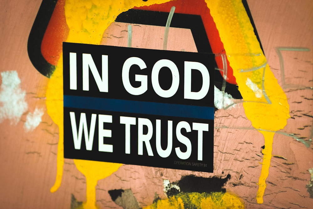 a sign that says in god we trust