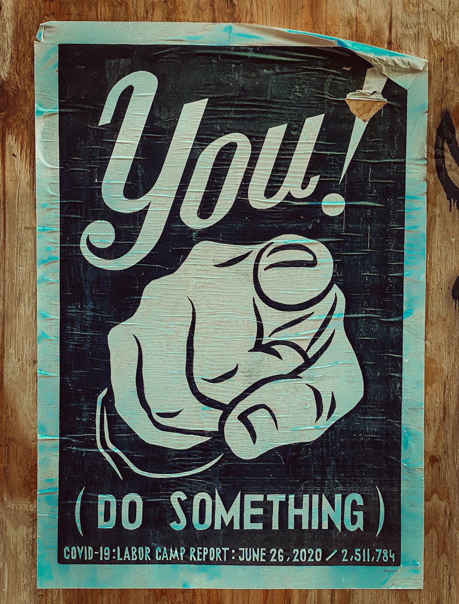Poster of a pointing hand with the word you
