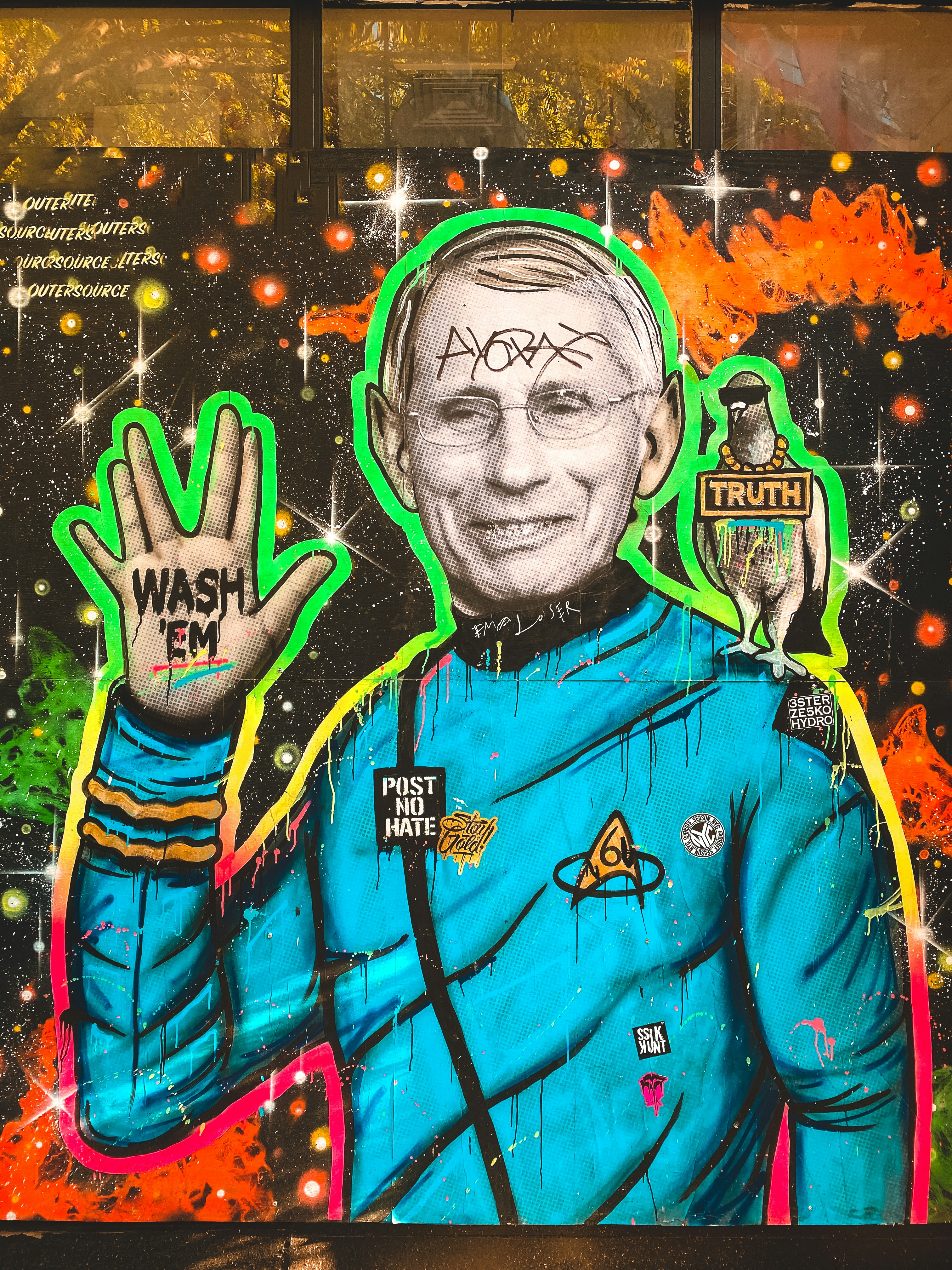 man in blue and orange zip up jacket