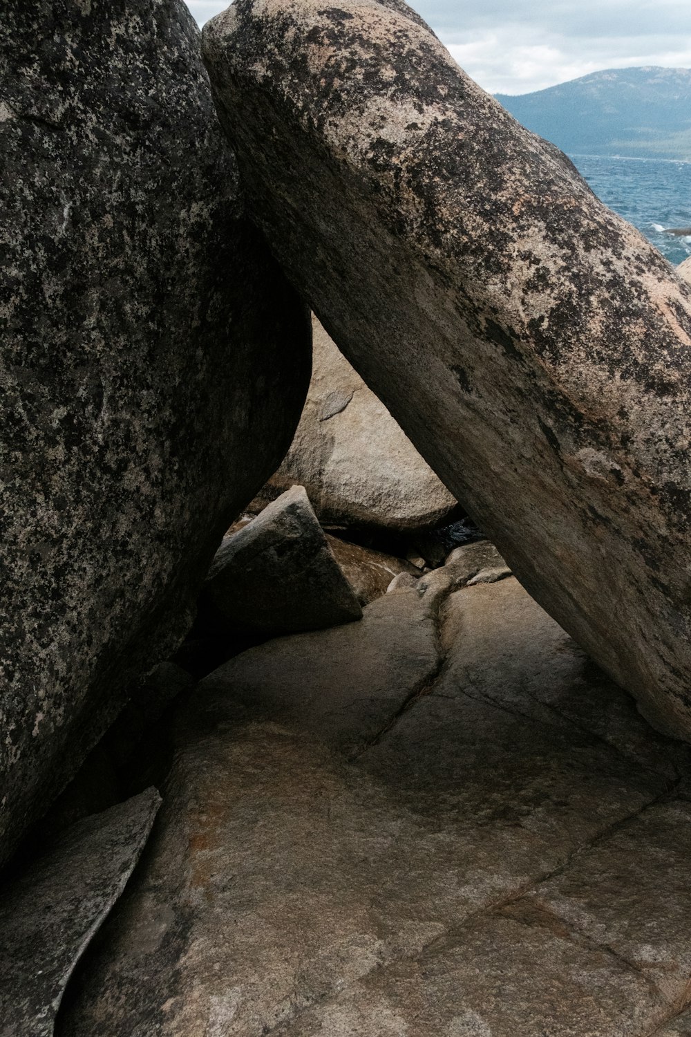 gray rock formation near body of water during daytime