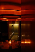 red and brown tunnel with glass windows