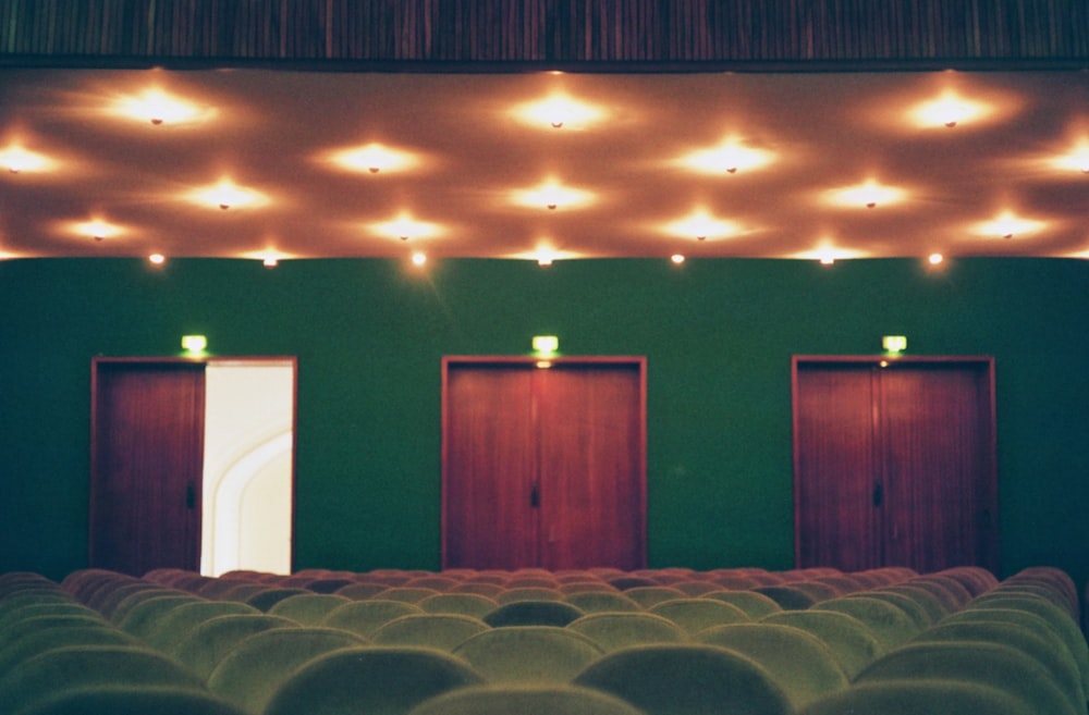 white chairs near red wall