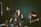 A group of friends having fun singing together on a living room stage.