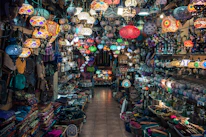 A vibrant store layout showcasing colorful lamps and chairs arranged to inspire a relaxed lifestyle.