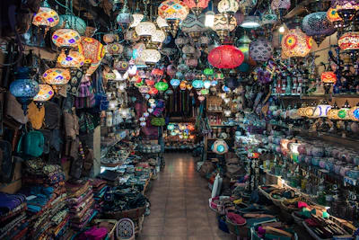 A vibrant store layout showcasing colorful lamps and chairs arranged to inspire a relaxed lifestyle.