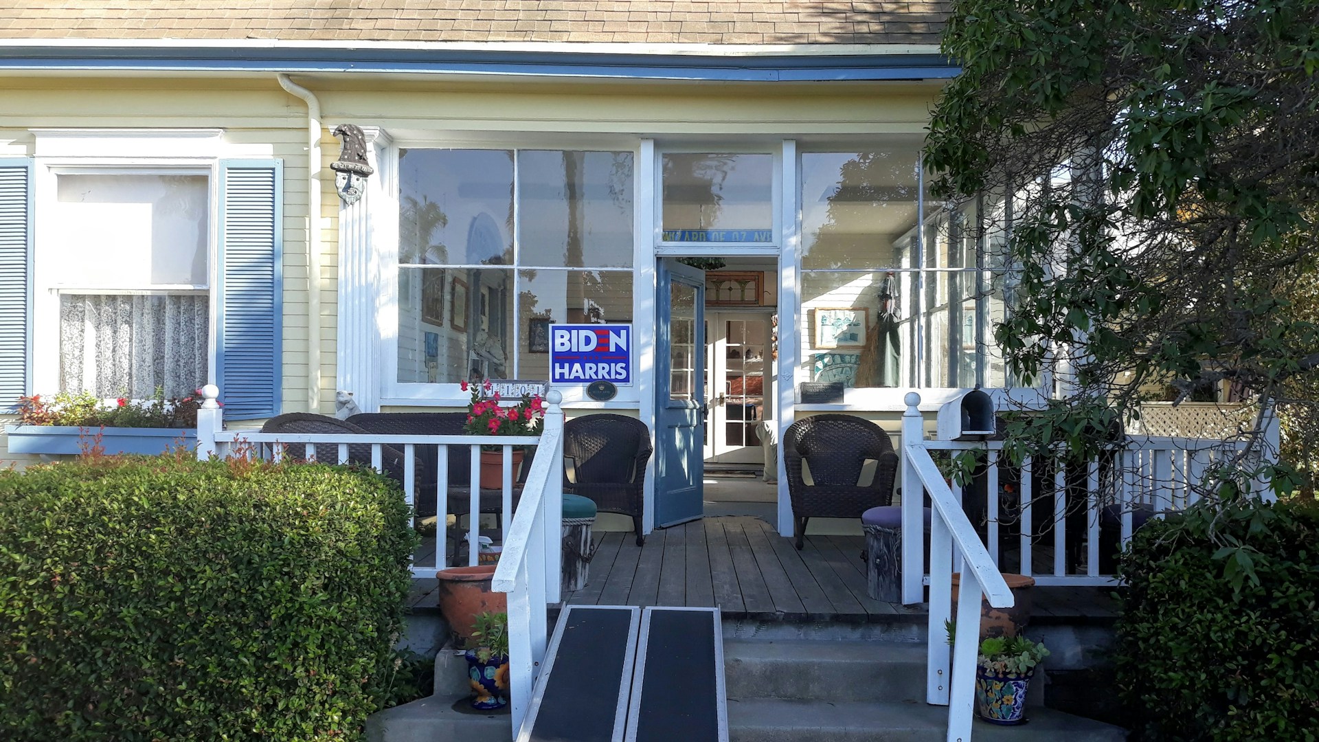 woman wearing yellow long-sleeved dress under white clouds and blue sky during daytime