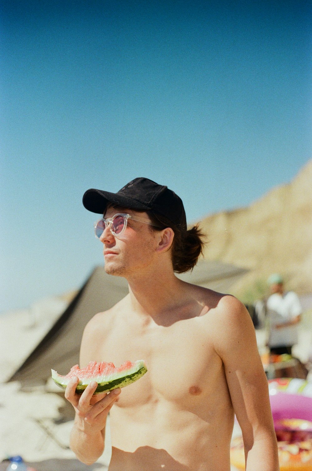 topless woman wearing black hat