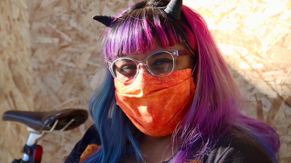 woman with purple hair wearing sunglasses