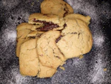 A stack of golden cake batter cookies with a soft, chewy texture on a rustic wooden board.