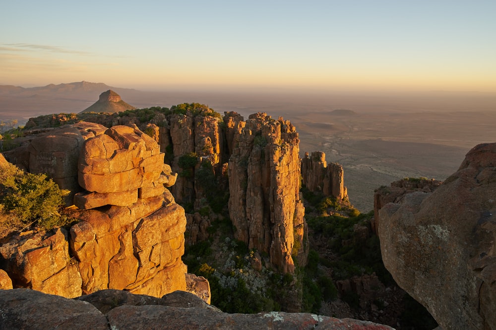 brown rock formation under white sky during daytime