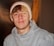 man in gray hoodie wearing white knit cap