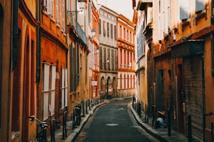 people walking on street between buildings during daytime
