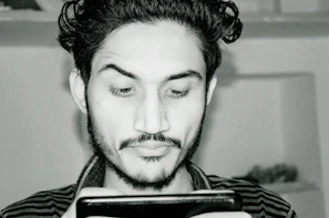 Realistic portrait of a person immersed in learning AI on a sleek digital device