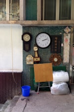 A collection of nxz digital clocks and timers displayed neatly on a shelf.